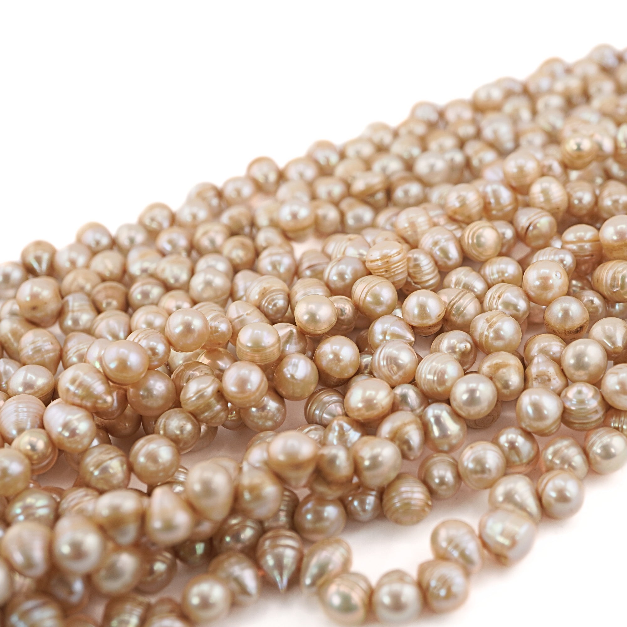 9 x 7 - 8 x 7 MM Golden Oval Freshwater Pearls Beads