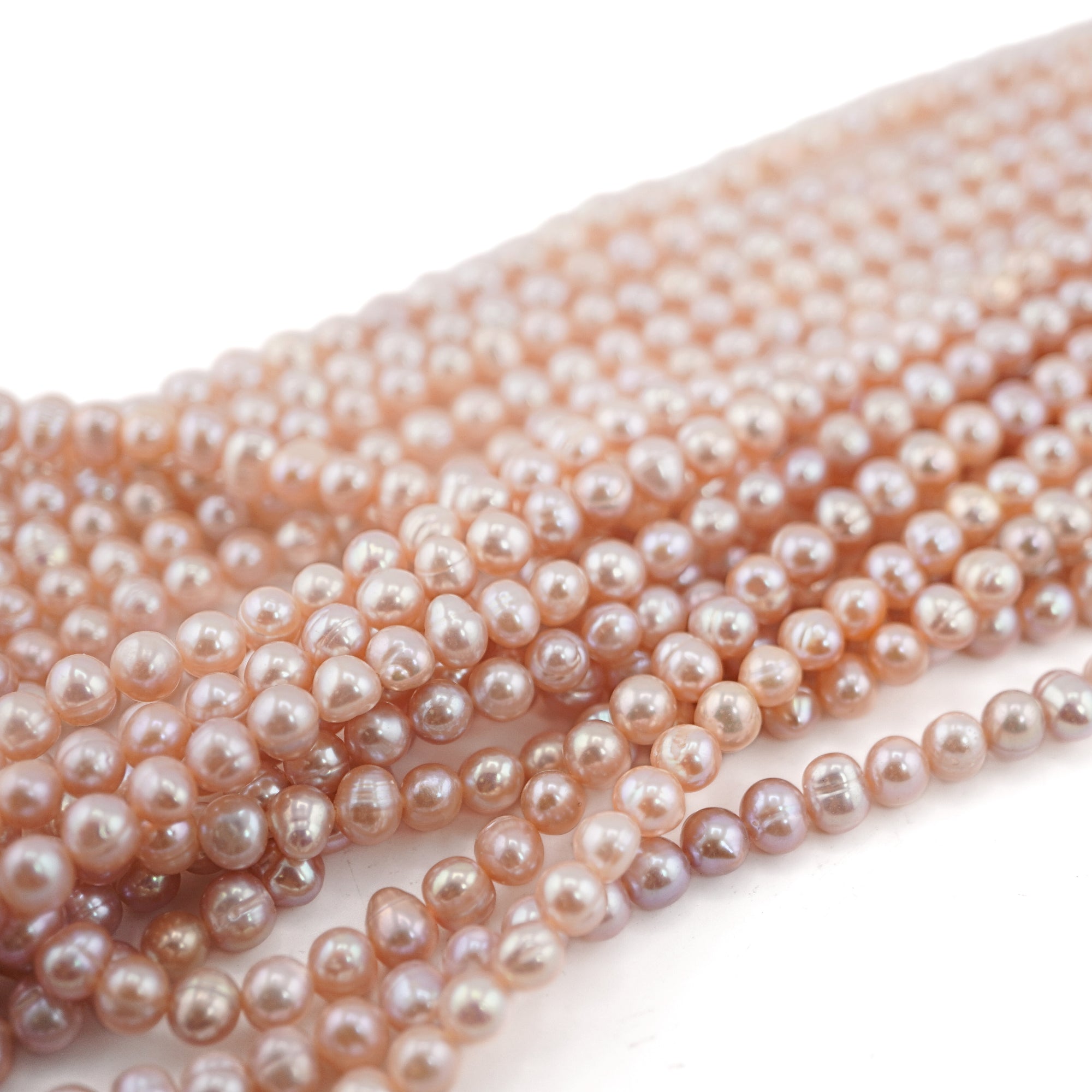 6 x 5 - 5 MM Peach Oval Freshwater Pearls Beads