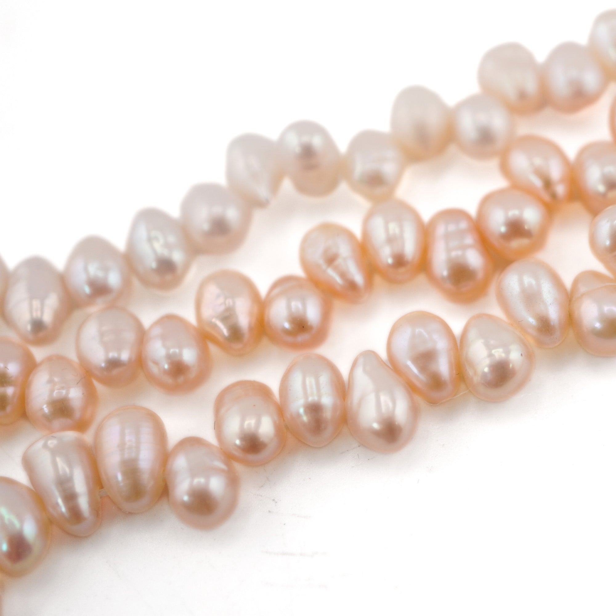 7.5 x 6.5 - 9 x 7 MM Peach Oval Freshwater Pearls Beads