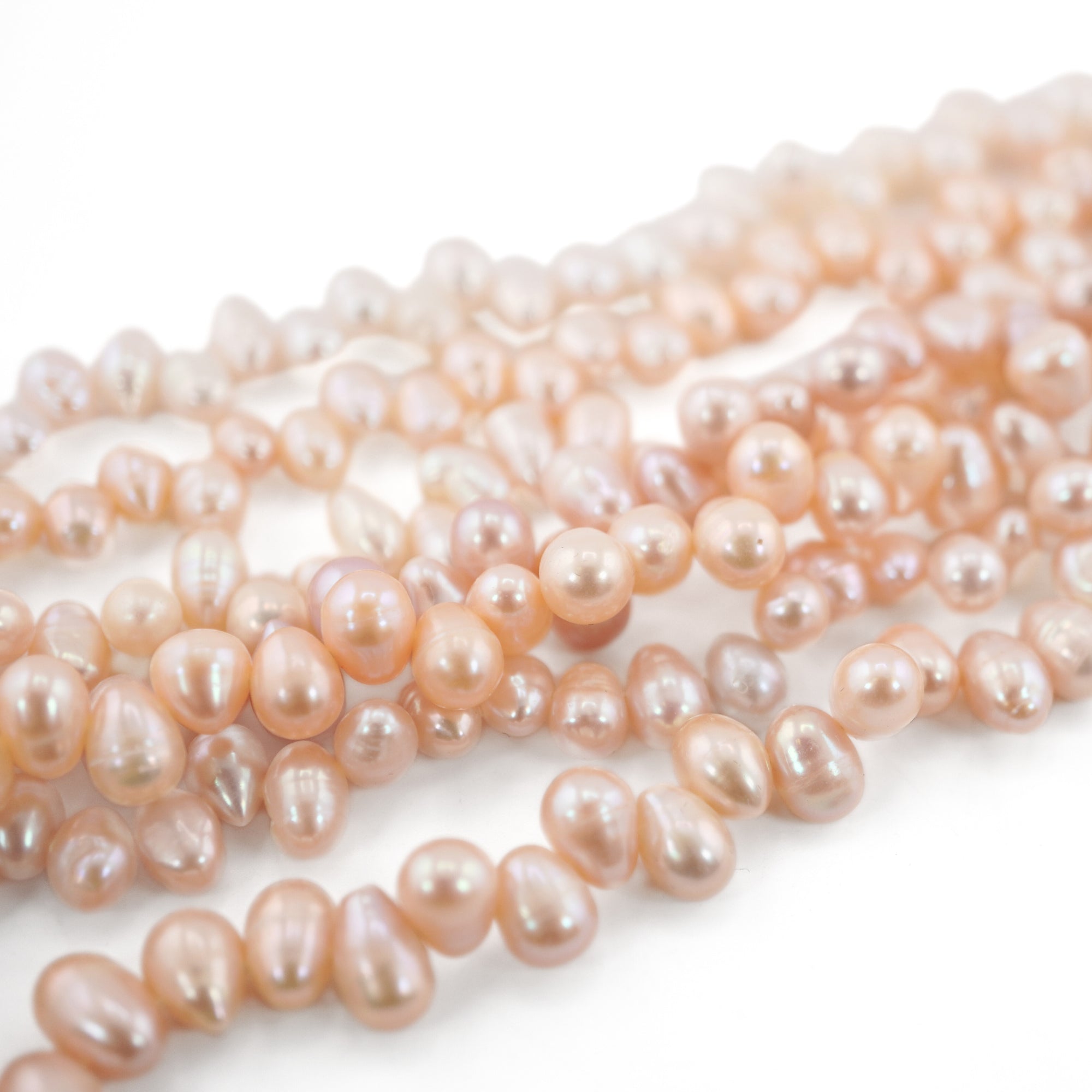 7.5 x 6.5 - 9 x 7 MM Peach Oval Freshwater Pearls Beads