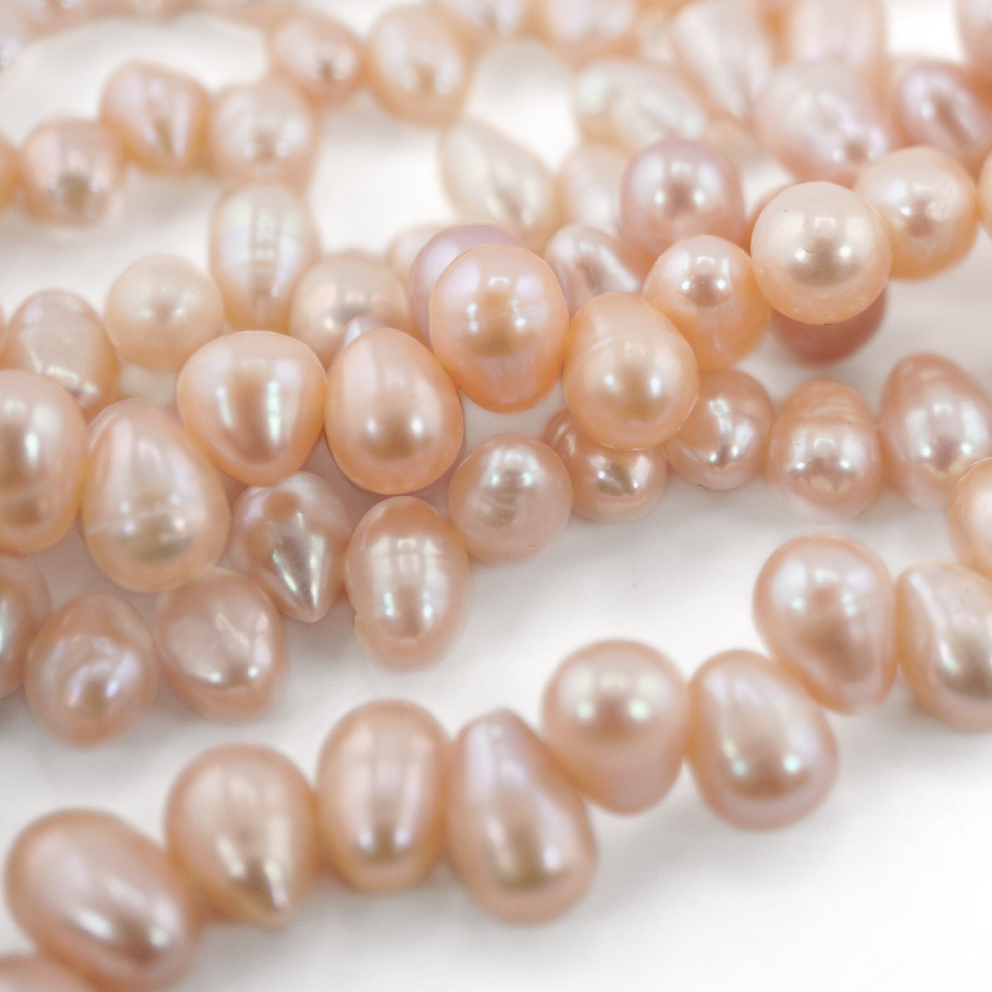 7.5 x 6.5 - 9 x 7 MM Peach Oval Freshwater Pearls Beads