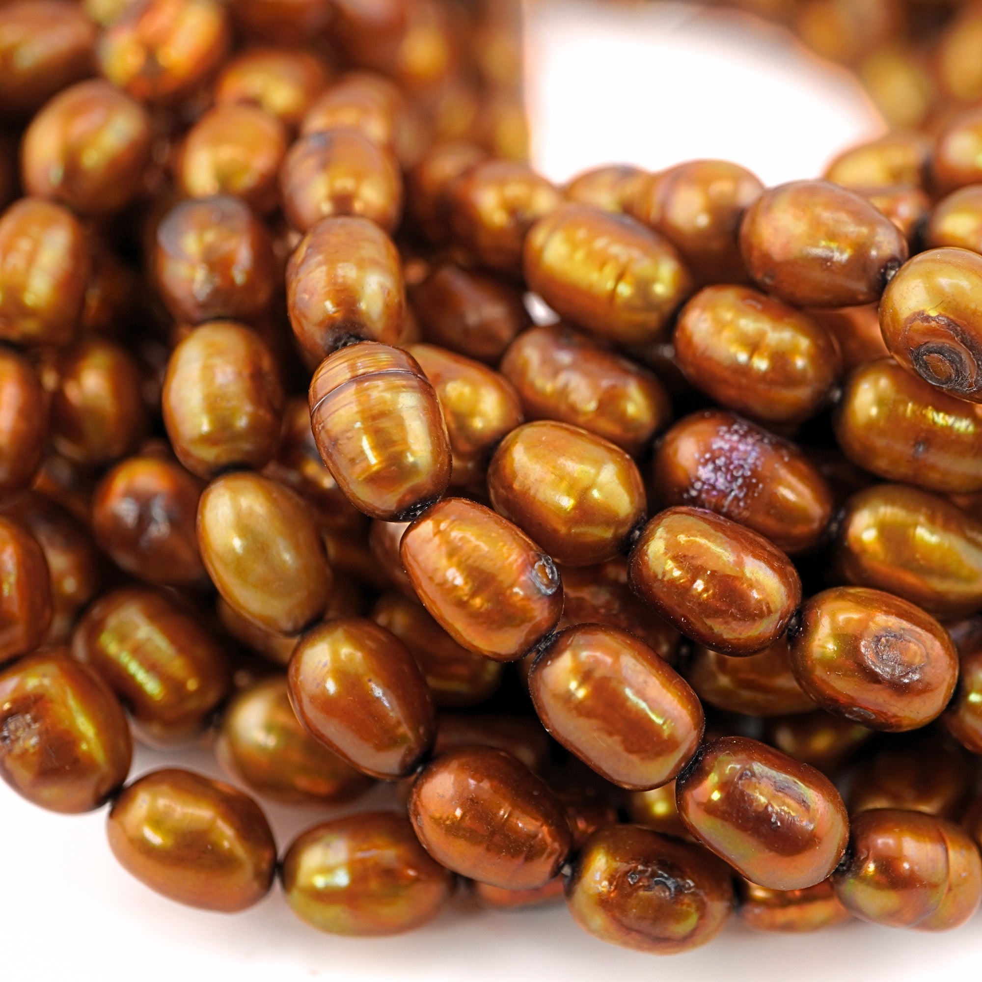 Freshwater pearl strand in gold tone

