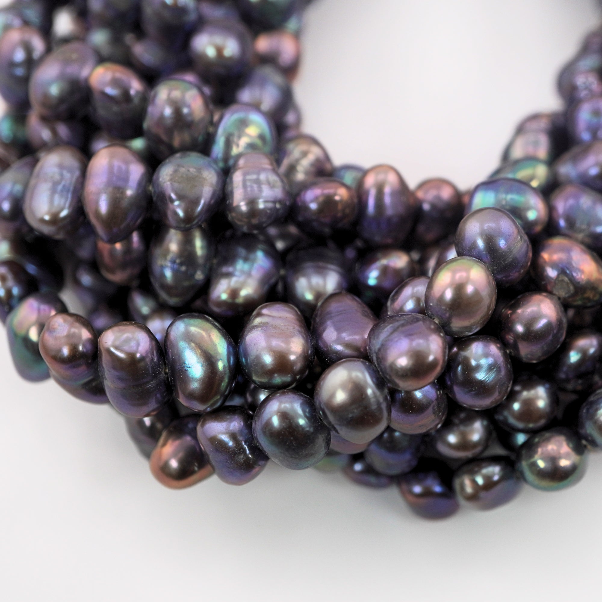 Iridescent navy blue freshwater pearls strands


