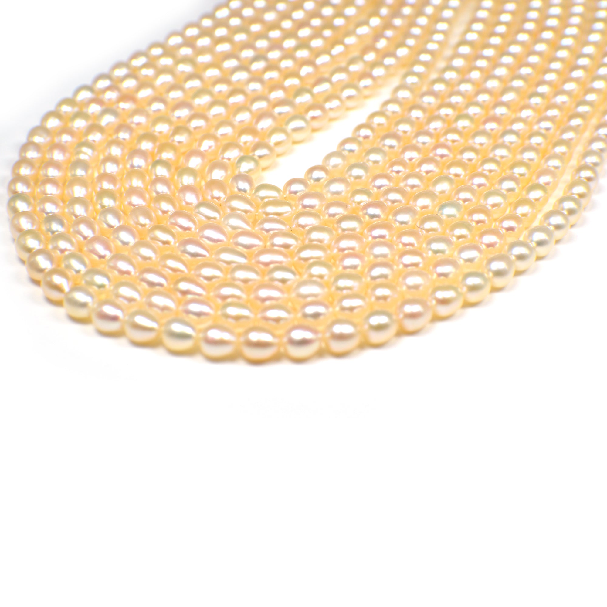 6x5 - 6.5x5.5 MM Peach Rice Freshwater Pearls Beads