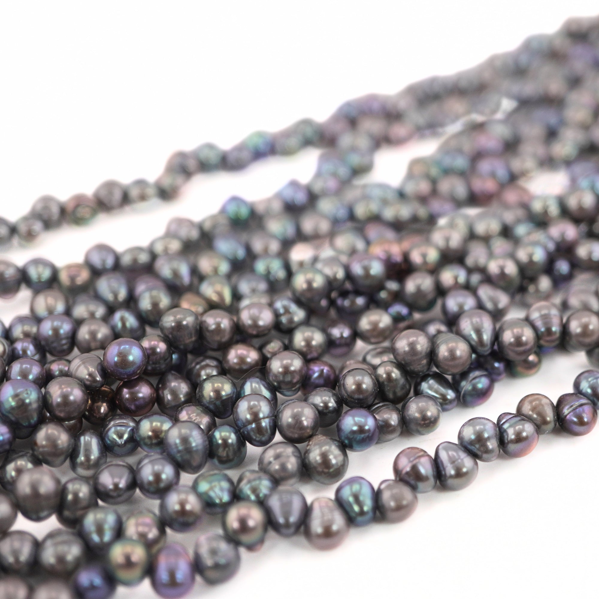 Lustrous Peacock Oval Beads for Custom Jewelry


