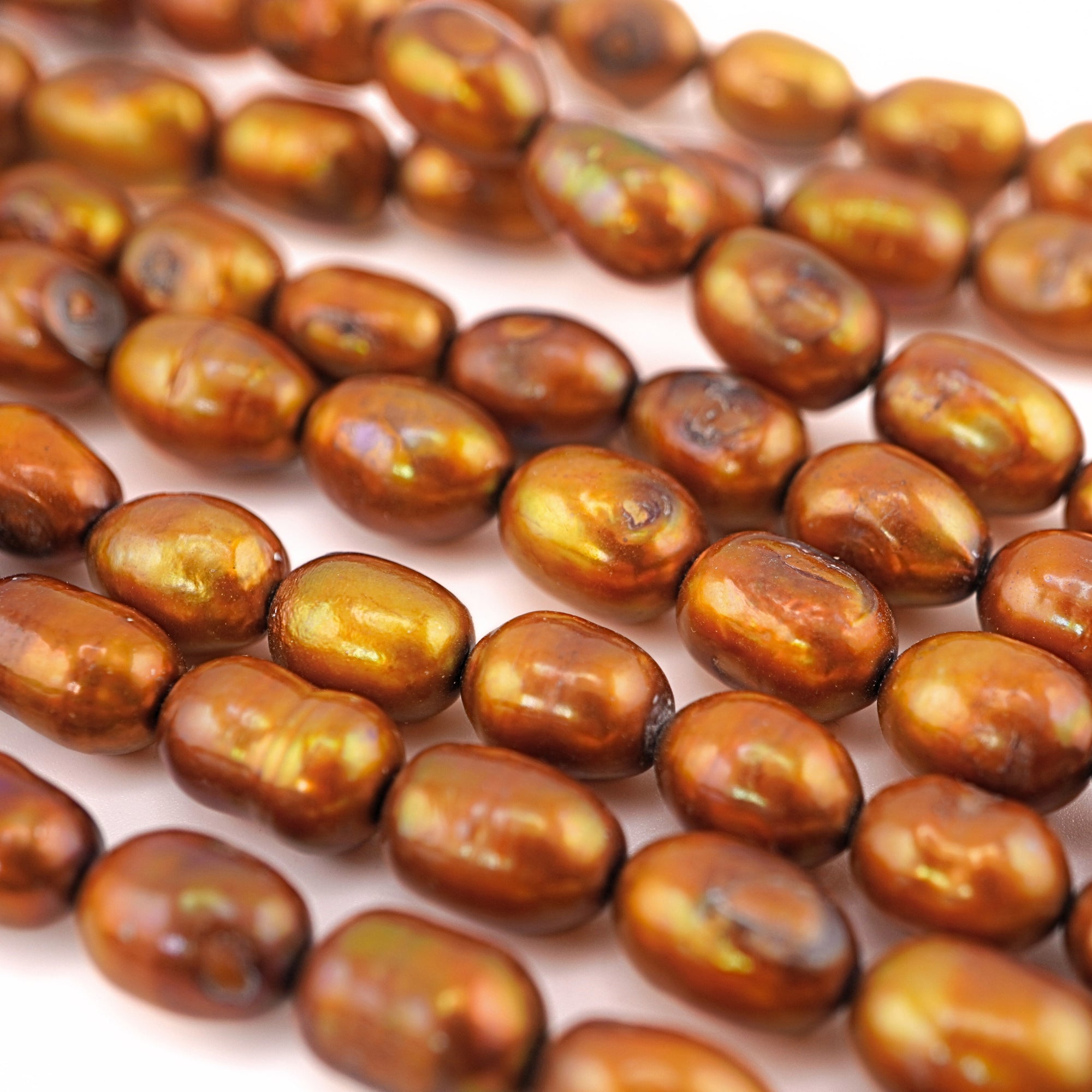 Metal gold oval pearls

