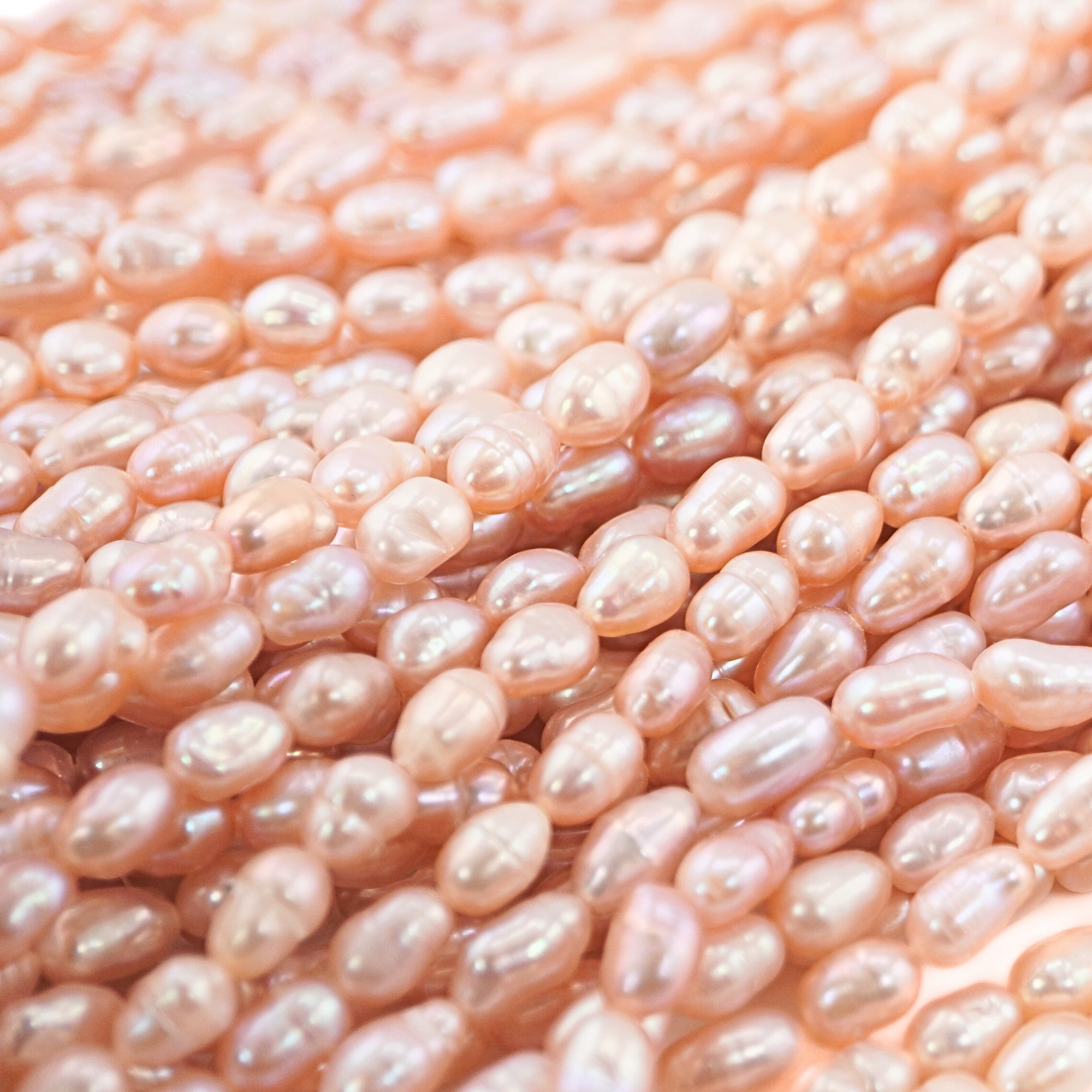 Natural peach oval pearls

