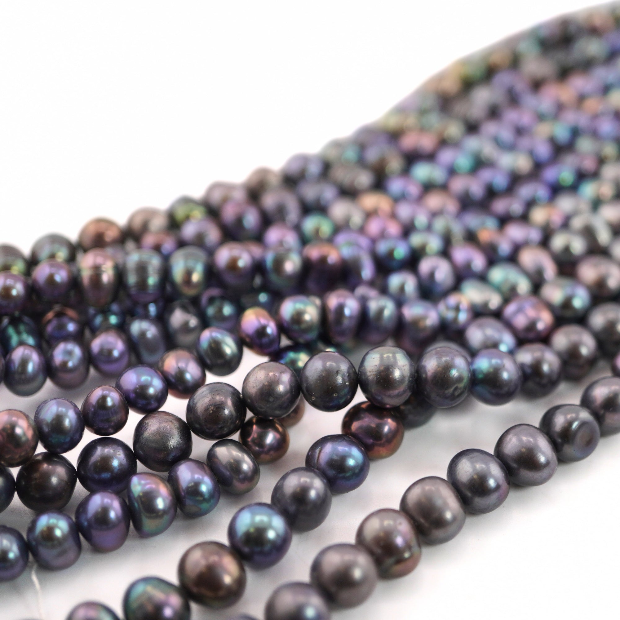 Near Round Peacock Pearls 8x7 MM

