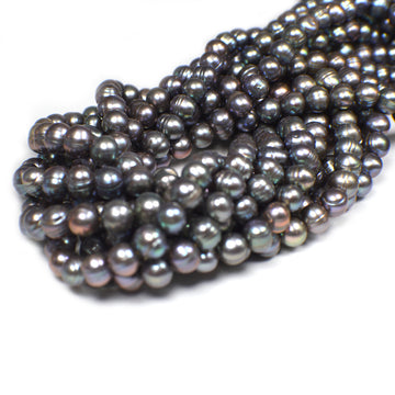 Real peacock colored pearl beads

