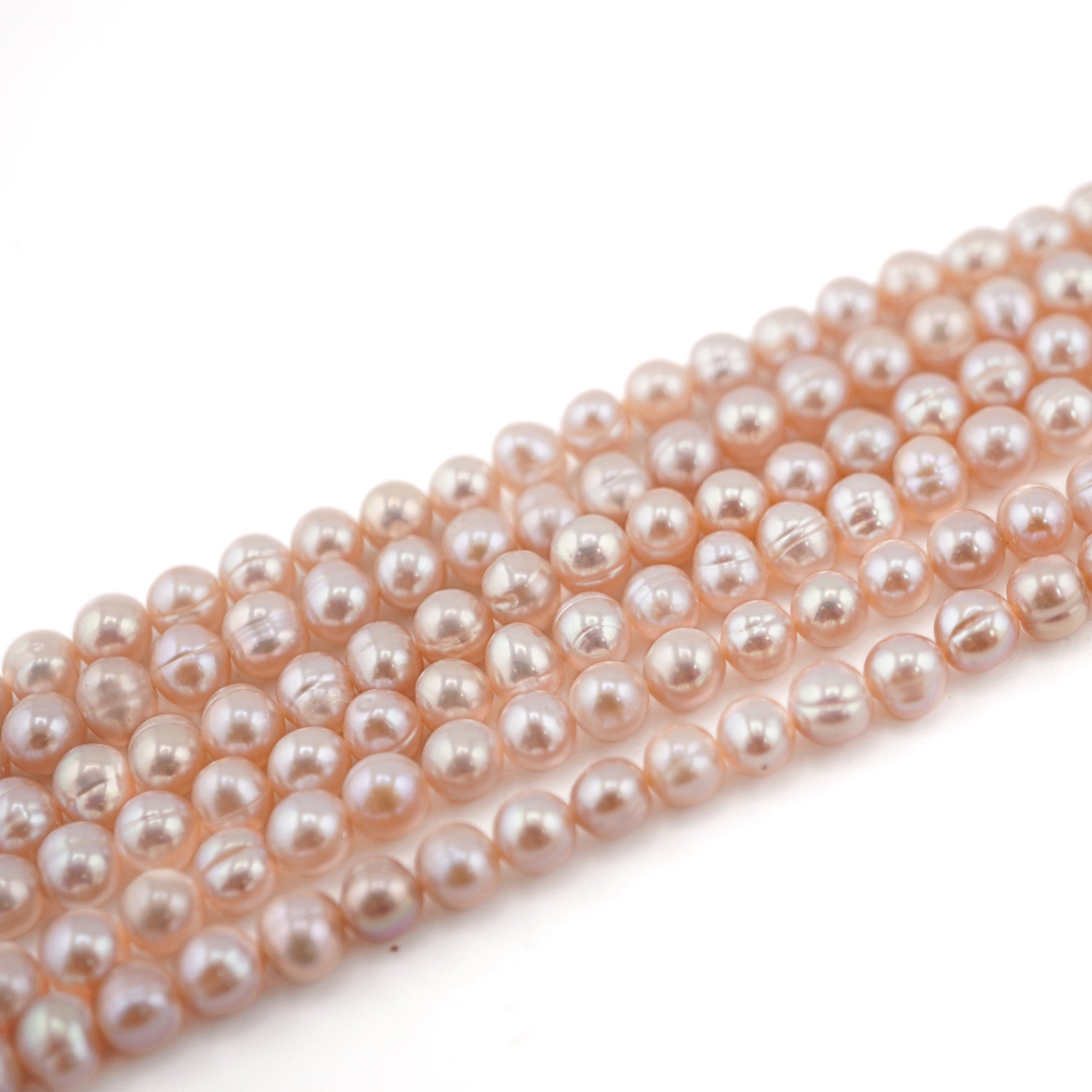 Wholesale Oval Pearls in Peach Tone

