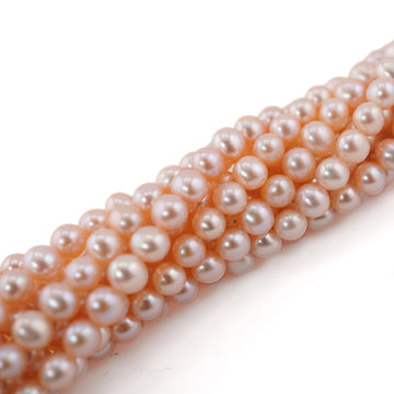 melon near round freshwater pearls

