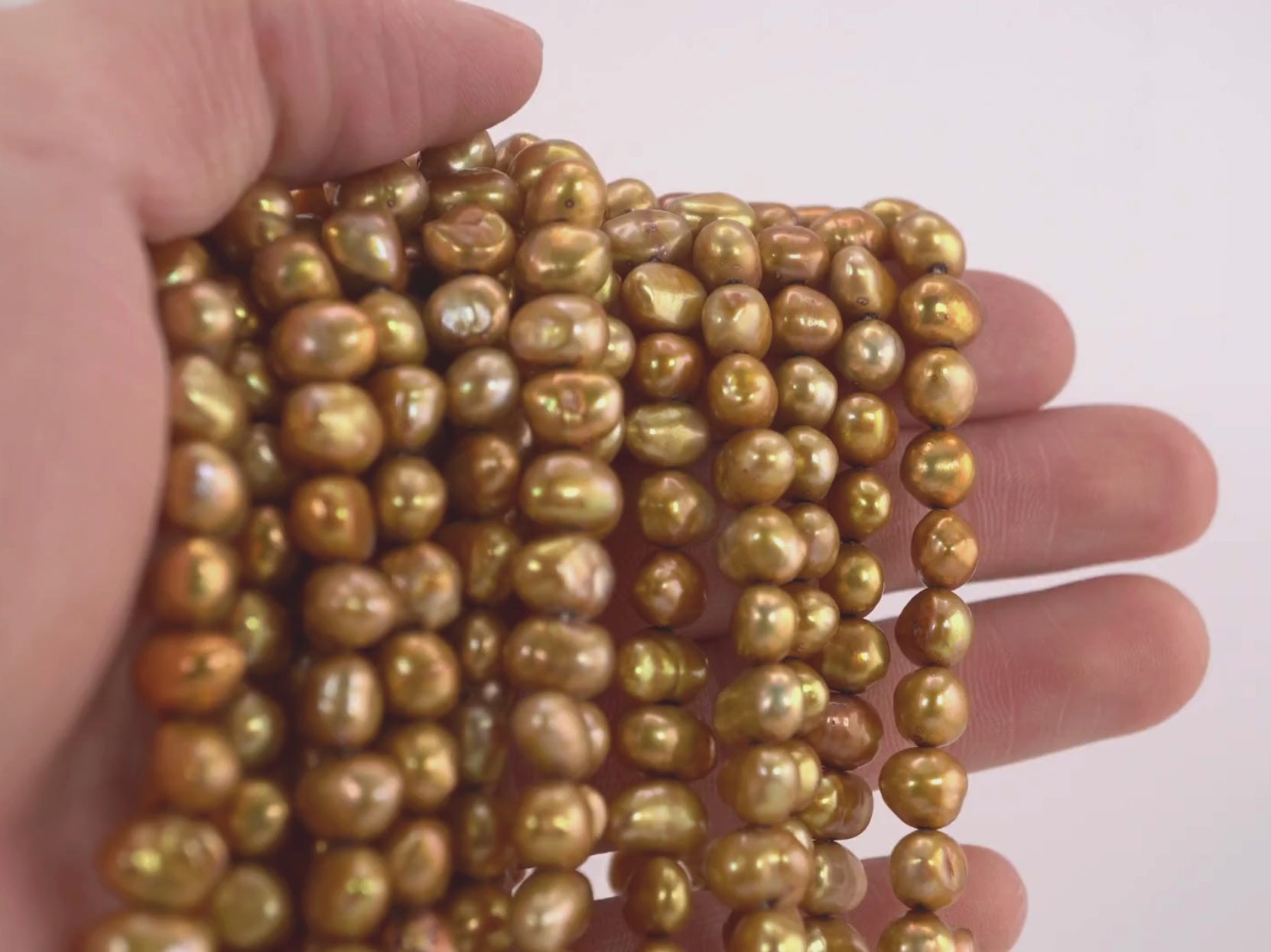 High-quality freshwater pearls in gold hue


