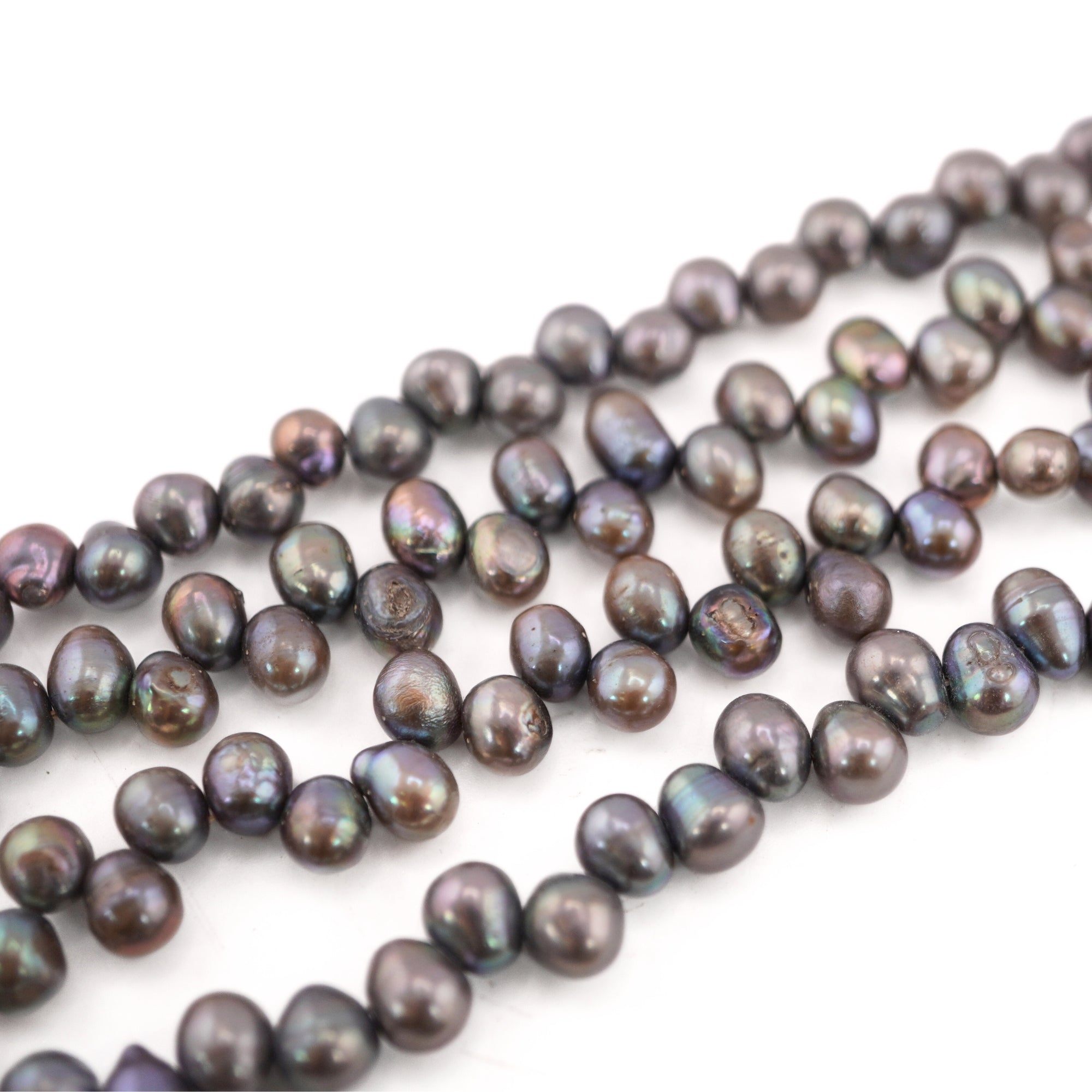smooth freshwater pearls in peacock shade

